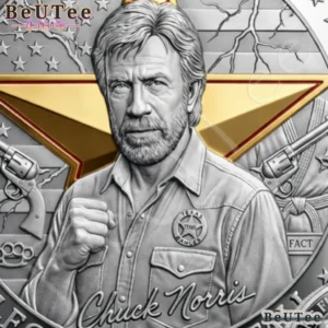 Close view of a silver memorial coin portrait with a gold star in the background.