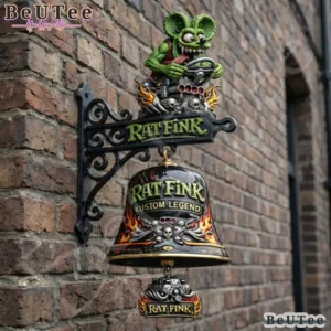 Rat Fink commemorative wall bell mounted on a brick wall.