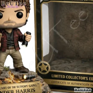 Close view of Xander Harris collectible figure beside display box.